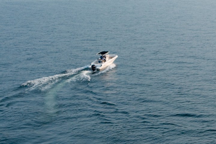 a man riding a wave on top of a body of water